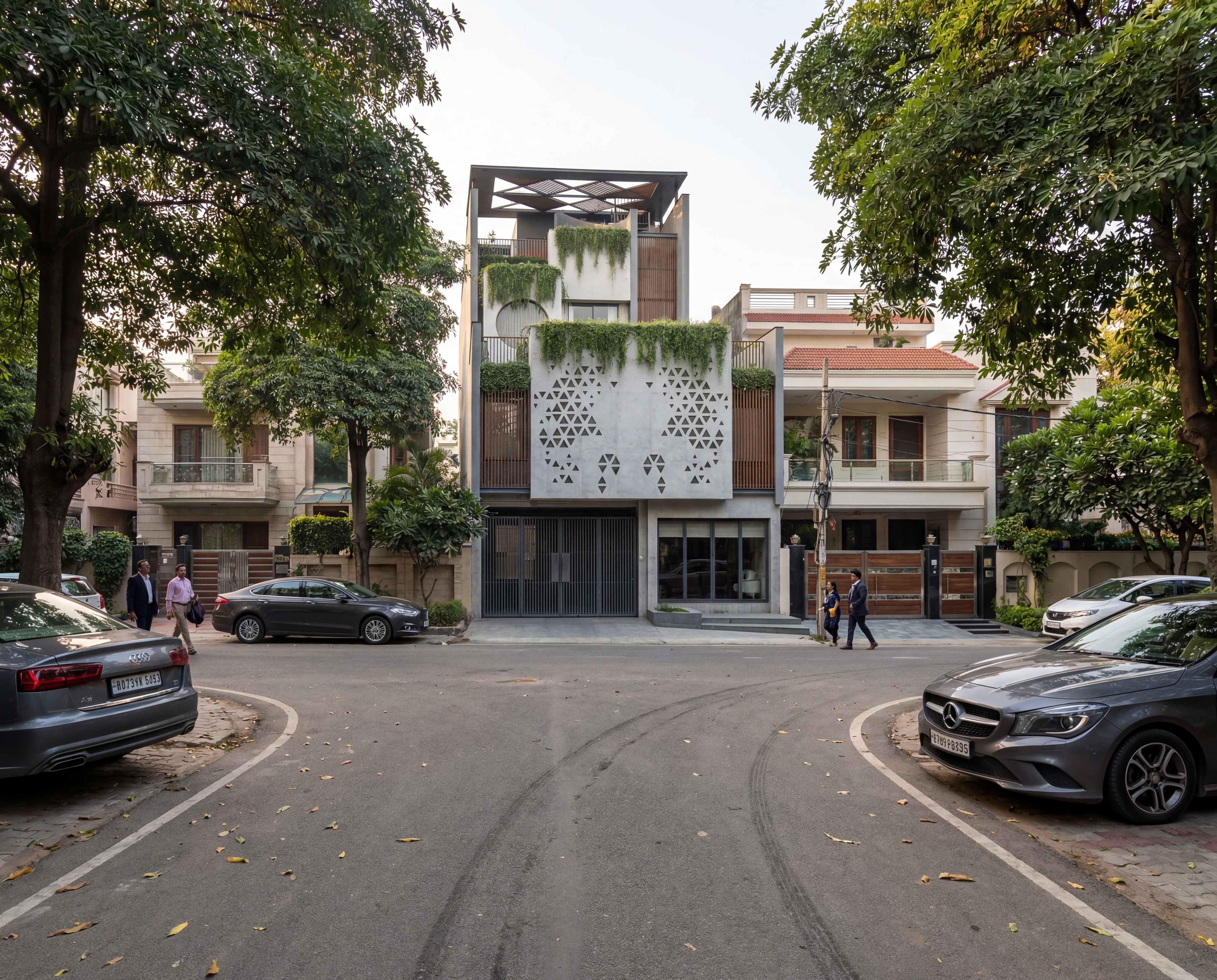 A contemporary tropical residence in Ghaziabad that blends bold architectural massing with cascading greenery, creating a seamless connection between nature and modern living.